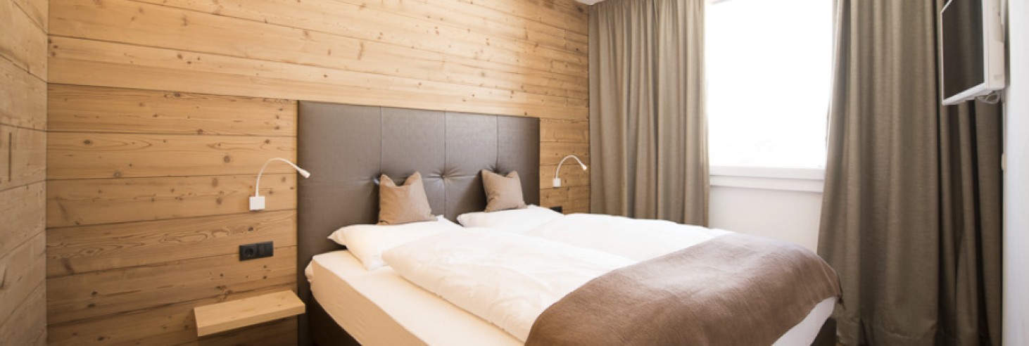 La camera da letto in uno chalet rustico e romantico sull'Alpe di Siusi